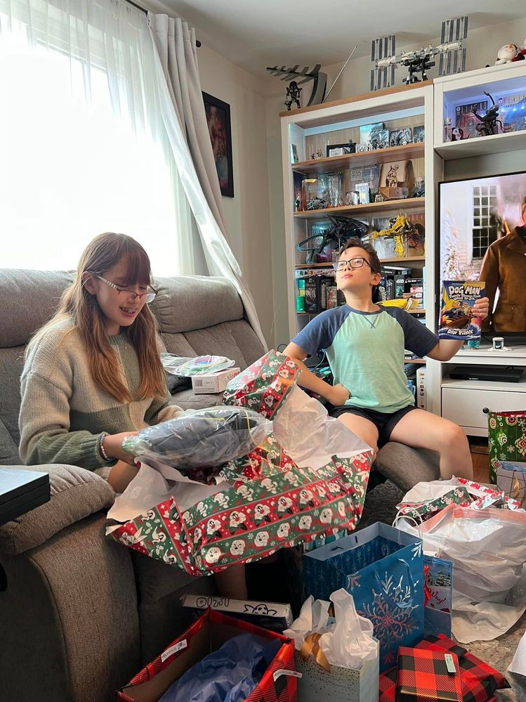 Ora and Arthor opening presents earlier this afternoon.
