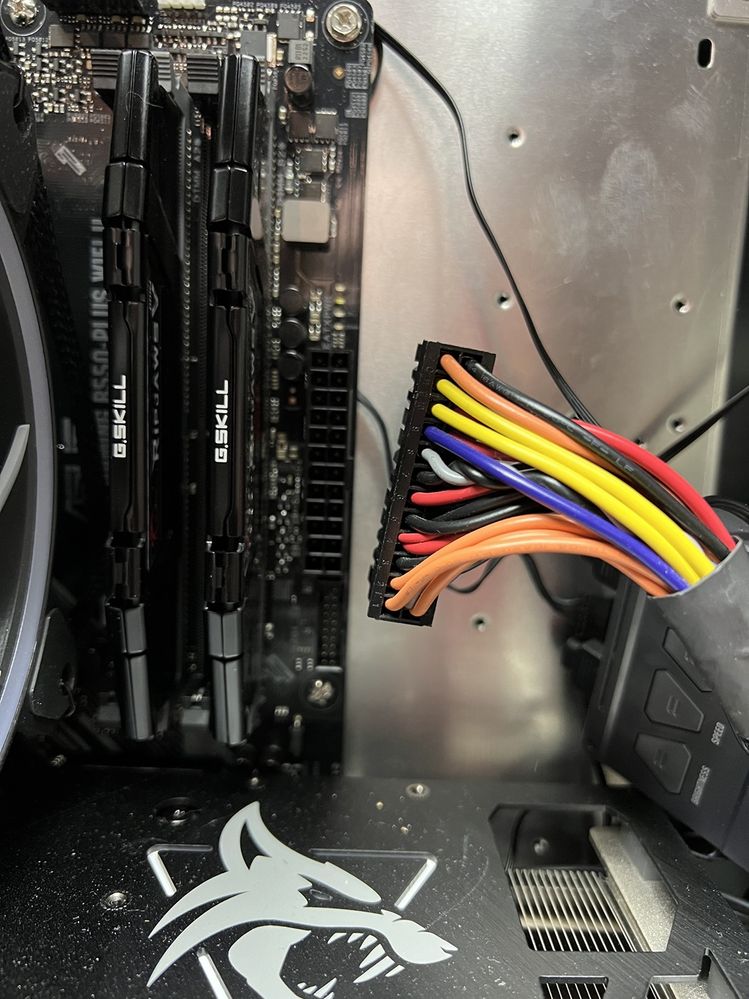 Pulling the motherboard power connector from the PSU....