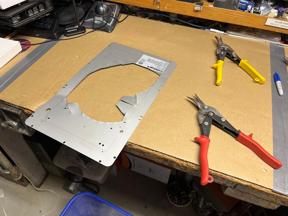 Cutting out the back cover with aircraft shears.  I need this cover for strength of the case.