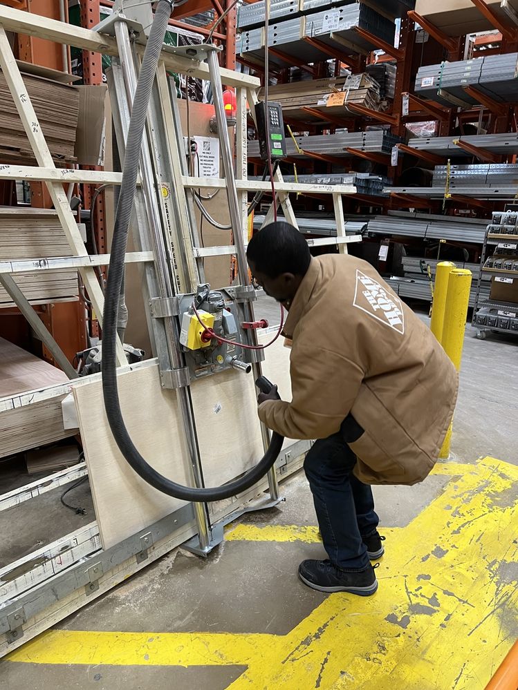 The guy at Home Depot making one cut for my two pieces of 2' x 4' plywood.