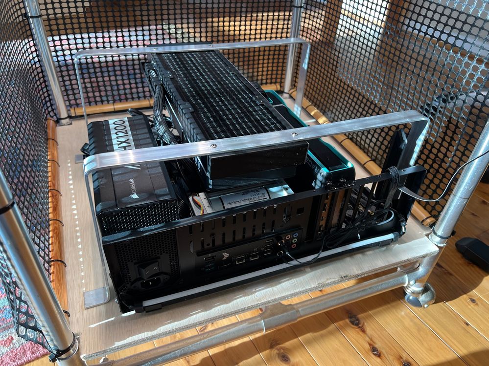 Placing the computer assembly into the bottom shelf of the plant rack.