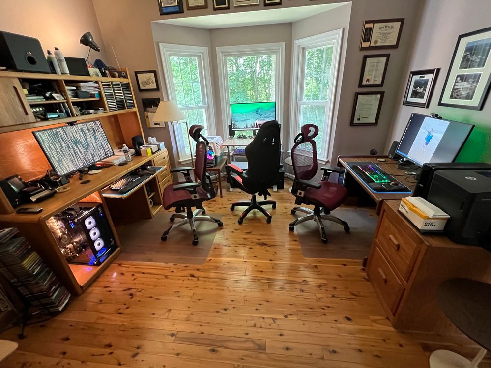 I actually had to help Molly or it would have taken all afternoon.  The new chair, on the right, matches the old chair on the left.  That's another gaming chair in the middle.