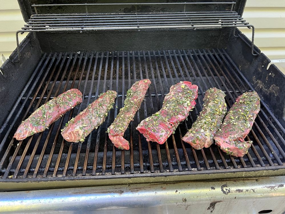 Hanger steaks on our grill.