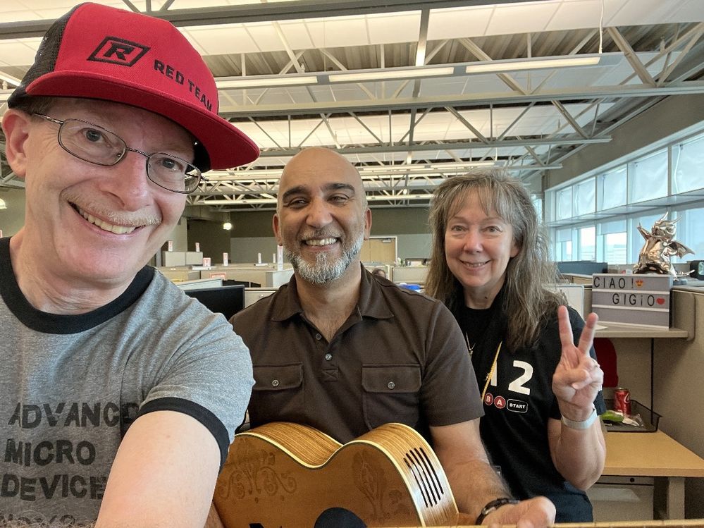 Myself and my wife Sandra with Sam.  He is holding that guitar with a computer built inside it.