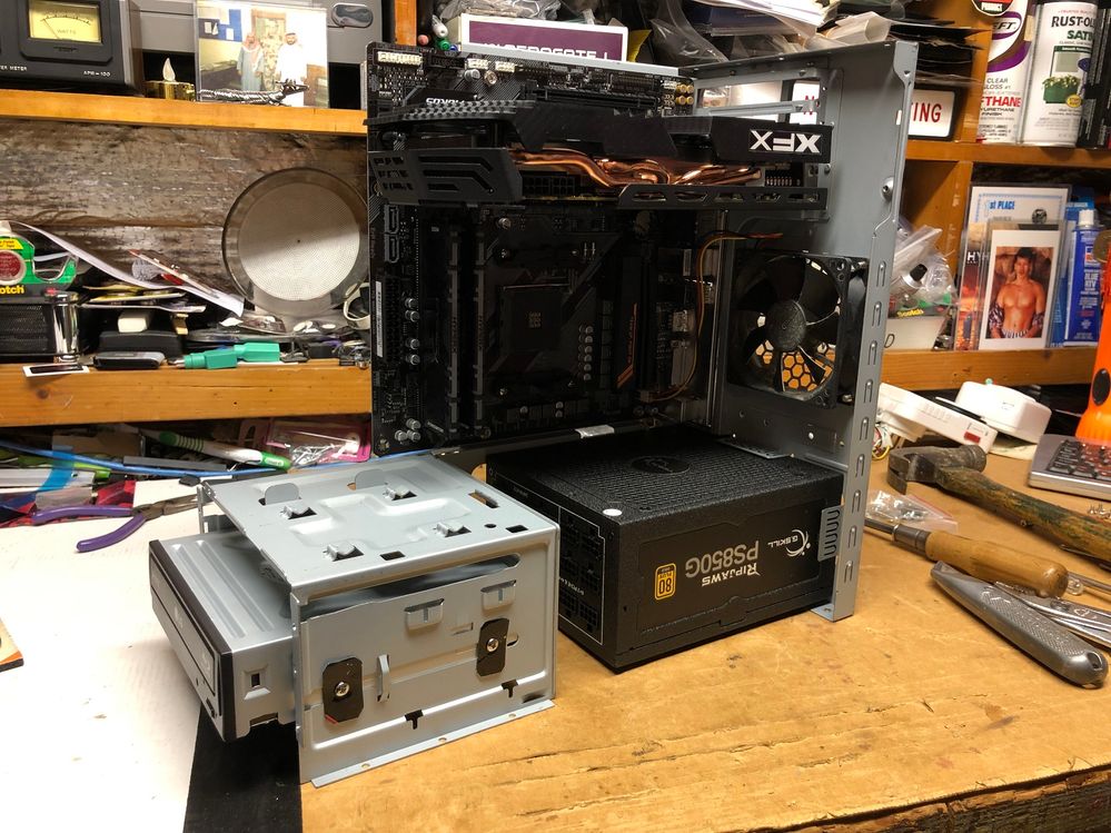 Cutting up an old computer chassis to hold the motherboard and optical drives.