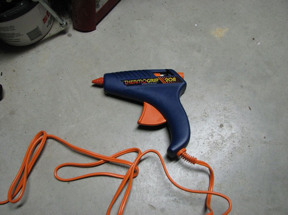 The Hot Glue Gun.  Yes, you plug it in to heat the glue.