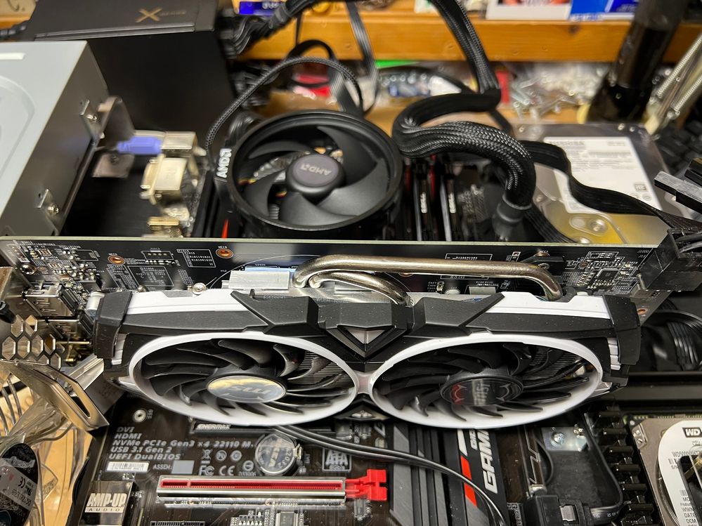 Time to remove the stock AMD CPU cooler.  Hey, that MSI RX580 video card is white and black.....